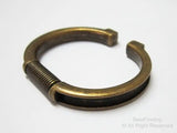 Spring cuff bracelet with groove