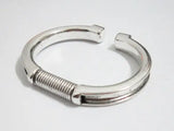 Spring cuff bracelet with groove