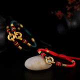 Sterling Silver Red Rope Bracelet with Peace Buckle Knots