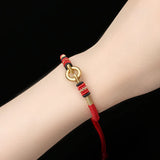 Sterling Silver Red Rope Bracelet with Peace Buckle Knots