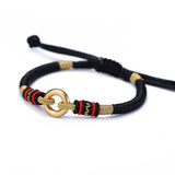 Sterling Silver Red Rope Bracelet with Peace Buckle Knots