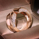 Geometric Cross Curved Rose Engagement Ring