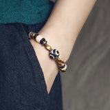 Natural Carved Animal Bone Bracelet with Ebony Spacer and Tibetan Evil Eyes Bead