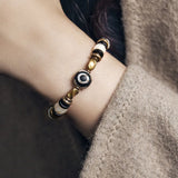Natural Carved Animal Bone Bracelet with Ebony Spacer and Tibetan Evil Eyes Bead