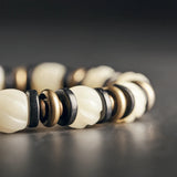Natural Carved Animal Bone Bracelet with Ebony Spacer and Tibetan Evil Eyes Bead