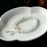 Handwoven Water Drop Style Emerald Bracelet with Shell Flowers