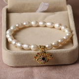 Freshwater Pearl Eye Hand Pendant Bracelet with Cubic Zirconium