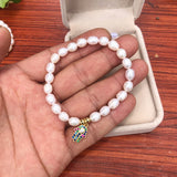 Freshwater Pearl Eye Hand Pendant Bracelet with Cubic Zirconium
