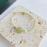 Green Hetian Jade Flowers Rope Weaving Bracelet 925 Silver Pendant