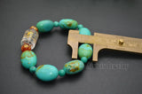 Turquoise Flat Oval Bead Stretch Bracelet with Lucky Beads