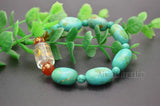 Turquoise Flat Oval Bead Stretch Bracelet with Lucky Beads