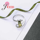 Arrival Curve Rings with Olive CZ 925 Sterling Silver Needle