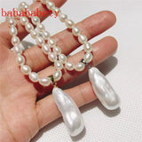 AA 5-6MM Rice Pearl Necklace 925 Sterling Silver Clasp