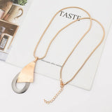 Irregular Long Geometric Sweater with Exaggerated Necklace