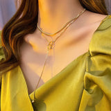 NC710 18KT Double Ring Tassel Pendant Necklace