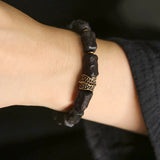 Hand Carved Ebony Bracelet with Unique Brass Charm