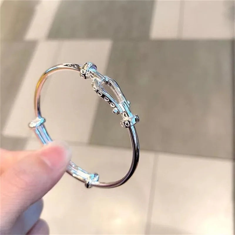 S999 Sterling Silver Horseshoe Buckle Bangle