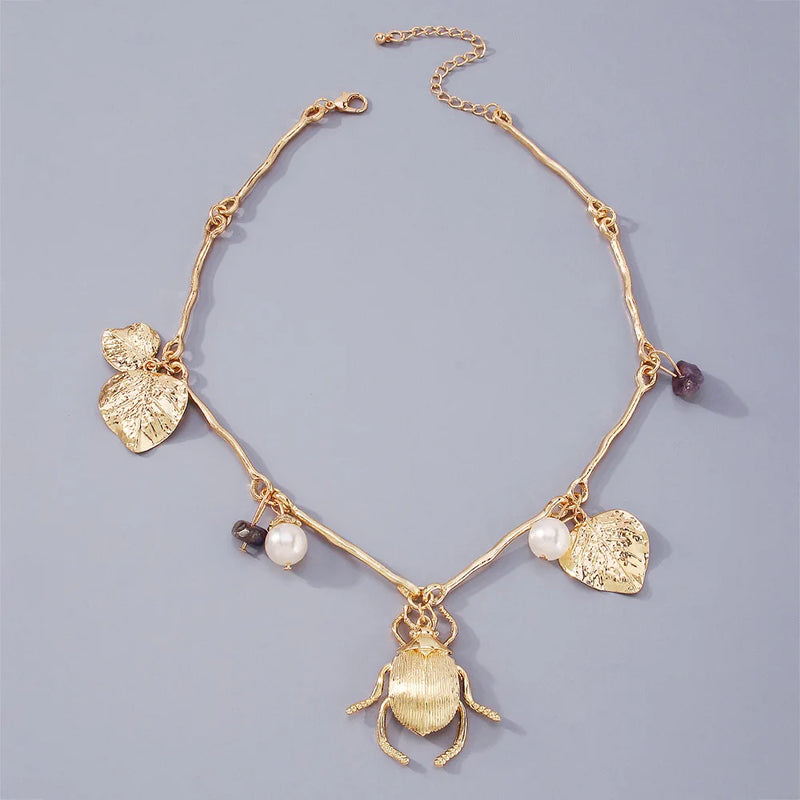 Exaggerated Gold Beetle Leaf Necklace with Pearl Stone Charms