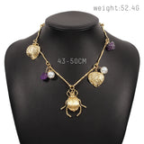 Exaggerated Gold Beetle Leaf Necklace with Pearl Stone Charms