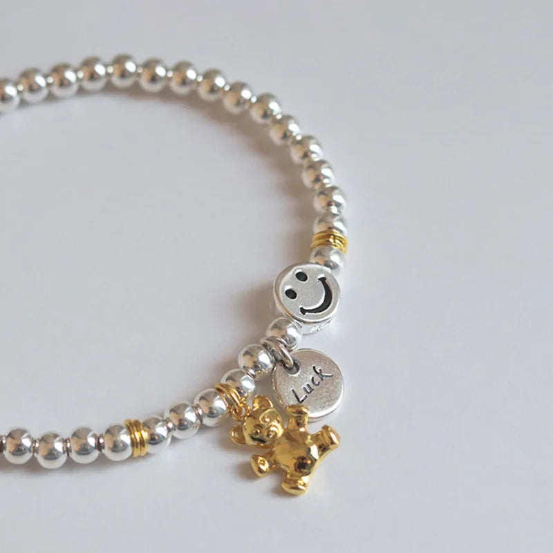 Silver Bead Bracelet with Smile Face Bear Pendant