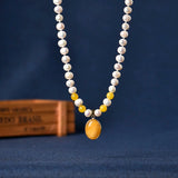 Slender Oval Pearl Necklace with Orange Beads Pendant