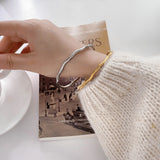 Stainless Steel Twisted Mosoobi Curve Line Bracelet Bangle Women