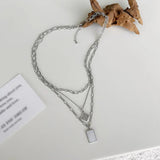 Geometric Pendant Multilayer Necklace in Wind