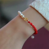 Adjustable Red Rope Bracelet with Copper Plated Pearl Accent