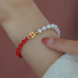 Adjustable Red Rope Bracelet with Copper Plated Pearl Accent