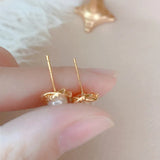 Elegant 14k Twist Stud Earrings with Zircon and Pearl
