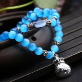 Cat Eye Stone Bracelet with Money Bag Pendant