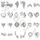 XIAOYI 100% s925 Butterfly Heart Hollow Earrings Sweet Small Female