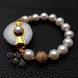 12mm Sea Shell Pearl Bracelet with 35x43mm Quartz Slice Cz Pave Insect Charm