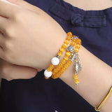 Yellow Cat Eye Stone Bracelet with Tibetan Silver Pendant