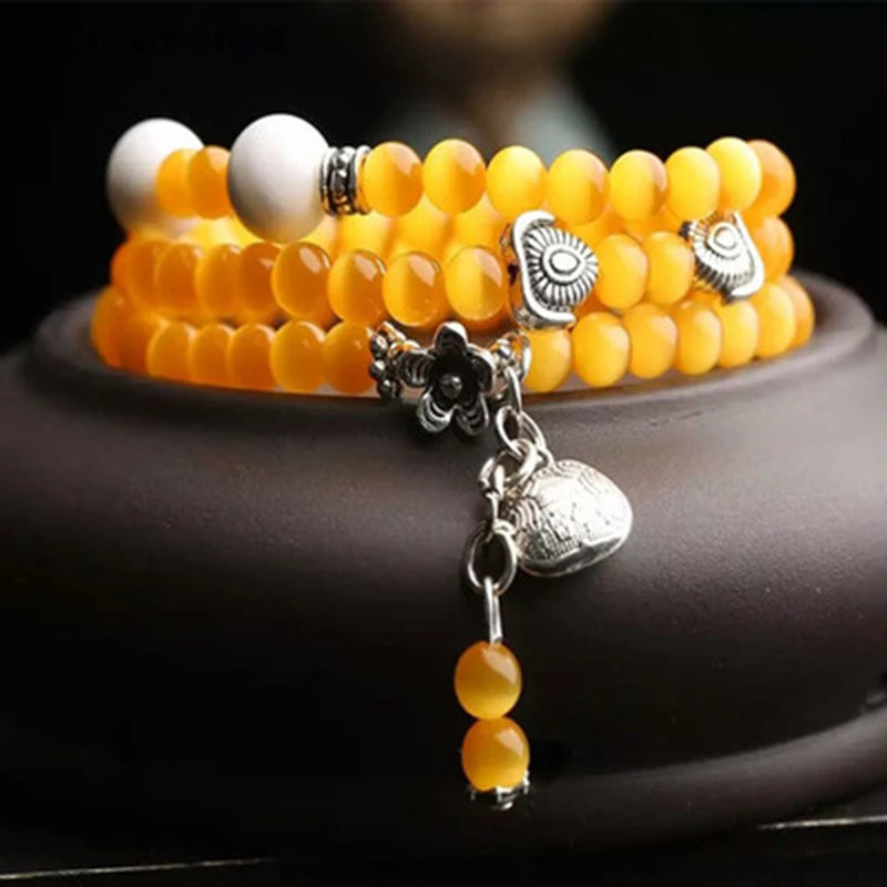 Yellow Cat Eye Stone Bracelet with Tibetan Silver Pendant