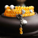 Yellow Cat Eye Stone Bracelet with Tibetan Silver Pendant