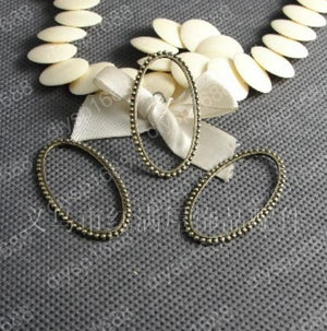 100 pcs Antique Bronze Oval Charms Pendants for DIY Jewelry Making