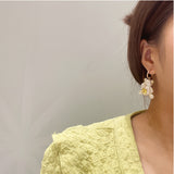 Zircon bear earrings set with pink gem