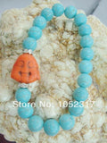 10mm Howlite Bead Orange Buddha Head Bracelet