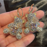 Zircon bear earrings set with pink gem