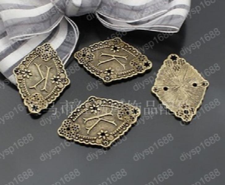 100 pcs Antique Bronze Plated Plate-K Charms Pendants