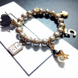 Elastic Pearl Beaded Bracelet with Crystal Love Flower